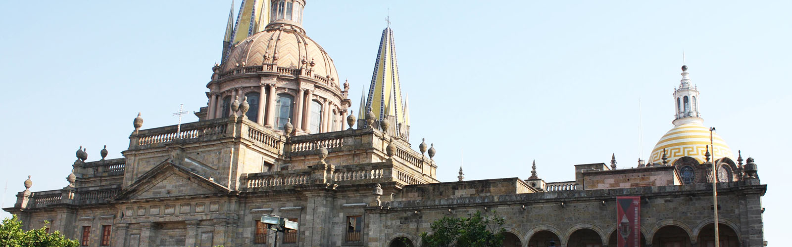 A large stone building with multiple domes and spires.